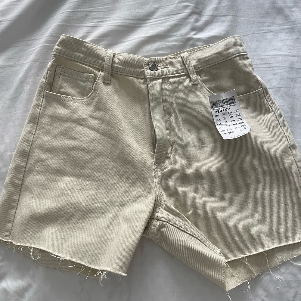 Cream slim high waisted shorts from Brandy Melville